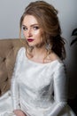 Portrait of a beautiful cute girl happy bride in an elegant dress with bright makeup in a white dress with a gorgeous wedding Royalty Free Stock Photo