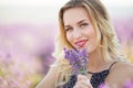 Portrait of beautiful girl lying on the lavender field Royalty Free Stock Photo