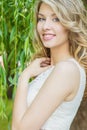 Portrait of beautiful happy smiling girl with big full lips, with white hair in a white dress Royalty Free Stock Photo