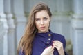 Portrait of a beautiful young woman in dark blue coat Royalty Free Stock Photo