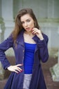 Portrait of a beautiful young woman in dark blue coat Royalty Free Stock Photo