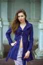 Portrait of a beautiful young woman in dark blue coat Royalty Free Stock Photo