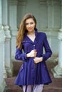 Portrait of a beautiful young woman in dark blue coat Royalty Free Stock Photo