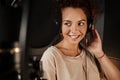 Portrait of beautiful singer listening sound in headphones working on new music album in recording studio Royalty Free Stock Photo