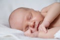 Portrait of a beautiful sleeping newborn baby on the white background, closeup Royalty Free Stock Photo