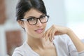 Portrait of beautiful smart young woman with eyeglasses on