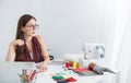 Portrait of beautiful smile asian designer woman with computer in tailer fabric fashion small business workshop. Royalty Free Stock Photo