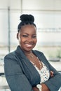 Portrait of a beautiful smiling black African business woman, arms crossed Royalty Free Stock Photo