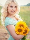 Portrait of a beautiful smiling blonde girl outdoors Royalty Free Stock Photo