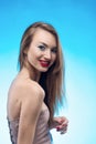 Portrait of the beautiful smiling blonde girl with red lips and Royalty Free Stock Photo