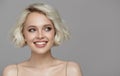 Portrait of a beautiful smiling blonde girl with a short haircut. Royalty Free Stock Photo