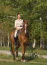 Portrait of beautiful smiling brunette horsewoman