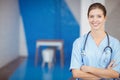 Portrait of beautiful smiling female doctor with arms crossed Royalty Free Stock Photo