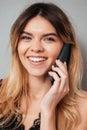 Portrait of a beautiful smiling girl talking on mobile phone Royalty Free Stock Photo