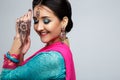 Portrait of beautiful smiling indian girl. Young indian woman model with traditional jewelry set Royalty Free Stock Photo