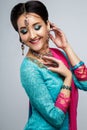 Portrait of beautiful smiling indian girl. Young indian woman model with traditional jewelry set Royalty Free Stock Photo