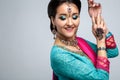 Portrait of beautiful smiling indian girl. Young indian woman model with traditional jewelry set Royalty Free Stock Photo