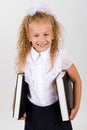 Portrait of beautiful smiling little girl in a school uniform Royalty Free Stock Photo