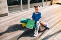 Portrait of beautiful smiling little girl wearing with shopping bag outdoors Royalty Free Stock Photo