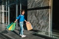 Portrait of beautiful smiling little girl wearing with shopping bag outdoors Royalty Free Stock Photo