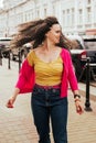 Portrait of beautiful smiling model with afro curls hairstyle dressed in summer hipster clothes.