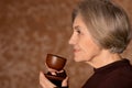 Portrait of beautiful smiling senior woman drinking tea Royalty Free Stock Photo