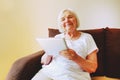 Portrait of beautiful smiling senior woman with the ipad.