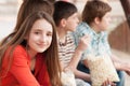 Portrait of beautiful smiling teenage girl with her friends Royalty Free Stock Photo