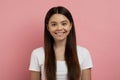 Portrait Of Beautiful Smiling Teenager Girl Posing Over Pink Studio Background Royalty Free Stock Photo