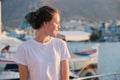 Portrait of beautiful smiling teenager girl in profile looking to the side Royalty Free Stock Photo