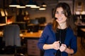 Portrait of a beautiful smiling woman call center operator with a headset at the desk Royalty Free Stock Photo