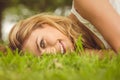 Portrait of beautiful smiling woman lying on grass Royalty Free Stock Photo