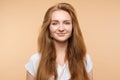 Portrait of beautiful smiling young red hair girl posing looking at camera medium close-up Royalty Free Stock Photo