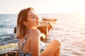 Portrait of beautiful smiling young woman in bikini on beach. Female model posing in swimsuit on the sea shore. Summer holidays, Royalty Free Stock Photo