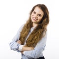 Portrait of a smiling young woman dressed in a blue shirt on a white background in passive attitude