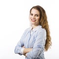 Portrait of a smiling young woman dressed in a blue shirt on a white background in passive attitude