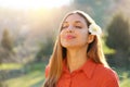 Portrait of beautiful smiling young woman enjoying yoga, relaxing, feeling alive, breathing fresh air, got freedom from work or