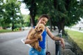 Teenager girl with red poodle