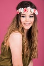 Summer time exotic floral portrait of young beautiful woman with long hair and hair flowers accessorize