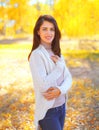 Portrait beautiful smiling young woman in sunny autumn Royalty Free Stock Photo