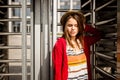 Portrait of a beautiful, stylish young Caucasian woman with a toothy smile, long developing hair in the wind and a straw Royalty Free Stock Photo