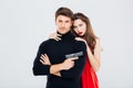 Portrait of beautiful stylish young couple with gun