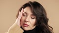 Mature business woman is suffered headache. Migraine, massages temples, magnetic storms