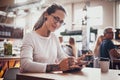 Portrait of beautiful tattoed girl with sketch pad Royalty Free Stock Photo