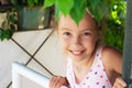 Portrait of beautiful teen girl smiling at the garden. Happy chi