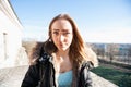 Portrait of beautiful teenage girl in jacket outdoors Royalty Free Stock Photo