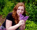 Portrait of a beautiful teenage girl with lilacs Royalty Free Stock Photo