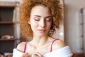 Portrait of beautiful tender redhead curly young woman