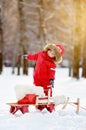 Portrait of beautiful toddler boy having fun in winter park Royalty Free Stock Photo