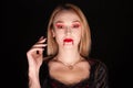 Portrait of beautiful vampire woman over black background Royalty Free Stock Photo
